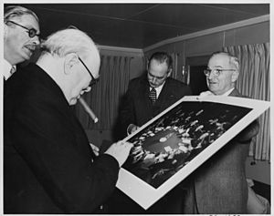 Photograph of President Truman giving British Prime Minister Winston Churchill a photograph taken at the 1945 Potsdam... - NARA - 199024.jpg