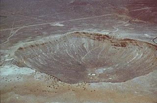 Image of a giant hole in the earth caused by a meteor.