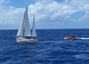 The crew of the Coast Guard Cutter Jospeh Gerczak assists four mariners aboard the disabled 38-foot sailing vessel Shyska 180 nautical miles off Hawaii Island, April 13, 2022.jpg