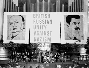 StateLibQld 2 108020 Guests seated on stage in front of a backdrop of giant posters at the Aid to Soviet Congress, Brisbane City Hall, October 1941.jpg