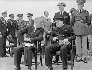 President Roosevelt and Winston Churchill seated on the quarterdeck of HMS PRINCE OF WALES for a Sunday service during the Atlantic Conference, 10 August 1941. A4815.jpg