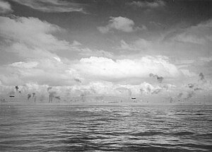 Mitsubishi G4M1 bombers fly low between Guadalcanal and Tulagi on 8 August 1942 (NH 97753).jpg