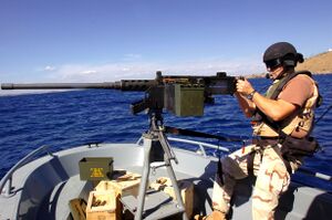 Coast Guard sailor points 50 caliber MG -- Guantanamo.JPG