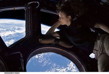 Self-portrait of astronaut and mission flight engineer Tracy Caldwell Dyson in the ISS cupola on September 11, 2010.
